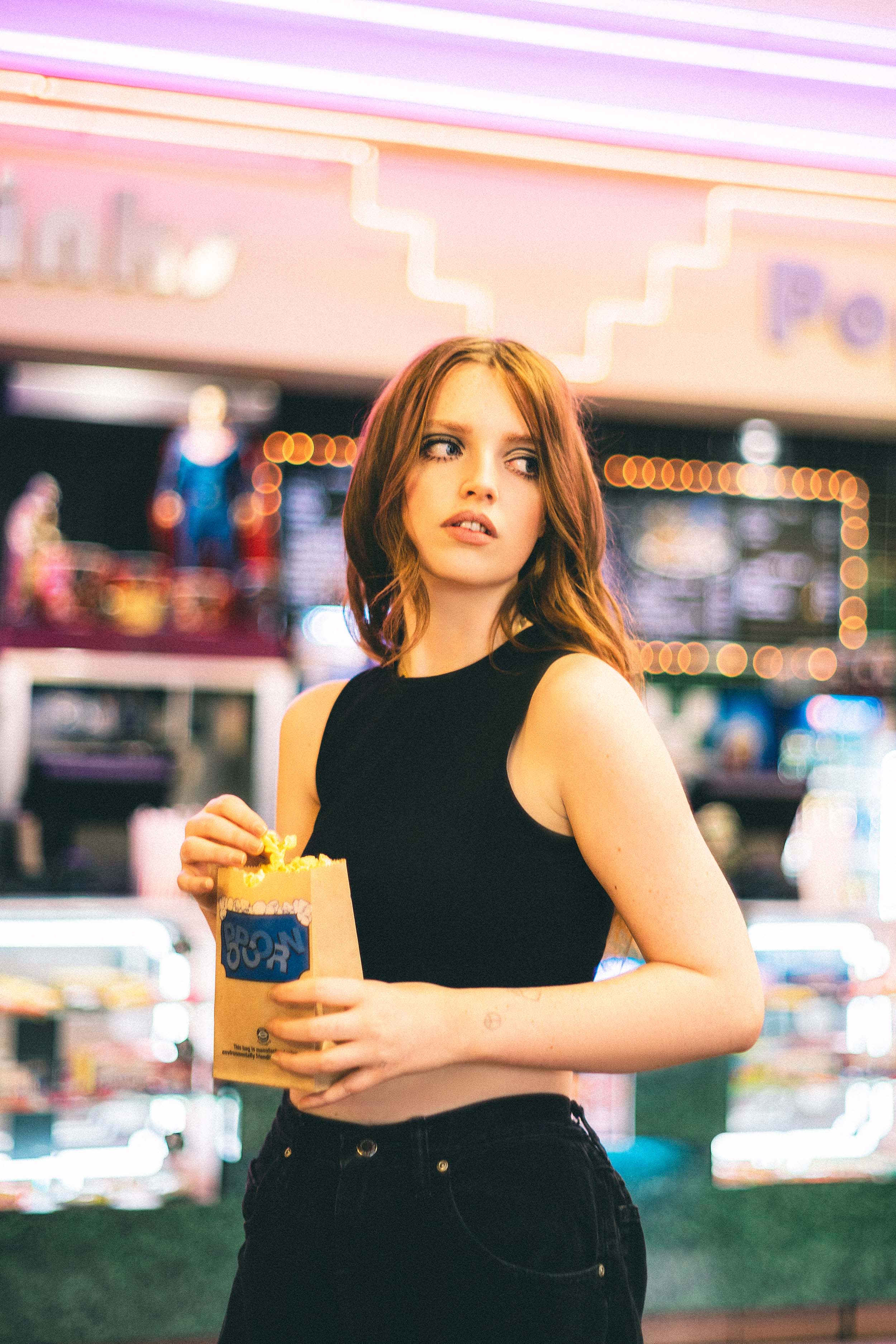 Cinematic Portraits with Vintage Flair by a Movie Theater — photograph 1 of 35